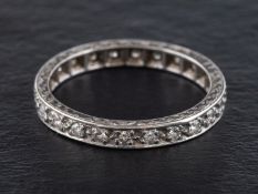 A round, brilliant-cut diamond, full-eternity ring, estimated total diamond weight ca. 0.