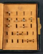 A collection of eleven dress studs and monogrammed leather case, including 2 stamped 9ct, weight ca.