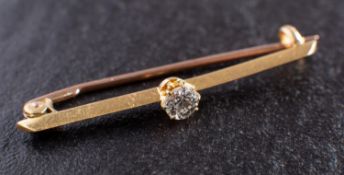 A round, brilliant-cut diamond bar brooch, estimated diamond weight ca. 0.