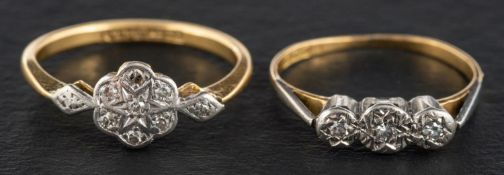 A single-cut diamond cluster and three-stone ring, both stamped '18CT' and 'PLAT',