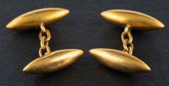 A pair of torpedo-shaped cufflinks, stamped '18', length of cufflink head ca. 2.