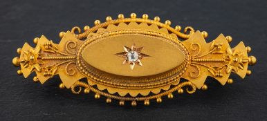 A Victorian, Etruscan Revival, single-cut diamond brooch, with cannetille work decoration,