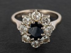 A sapphire and round, brilliant-cut diamond cluster ring, estimated sapphire weight ca. 0.