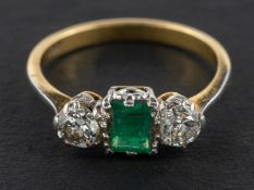 A rectangular, step-cut emerald and old-cut diamond, three-stone ring, estimated emerald weight ca.