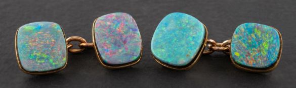 A pair of cushion-shaped, black opal doublet cuff-links, length of cufflink head ca. 0.
