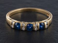 An 18ct gold, sapphire and round, brilliant-cut diamond, half-eternity ring,