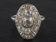An old-cut diamond cluster ring, estimated weight of principal diamond ca. 0.