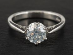 A platinum, round, brilliant-cut diamond, single-stone ring,