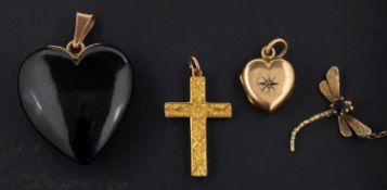 Four pendants, including a cruciform pendant with foliate engraving,