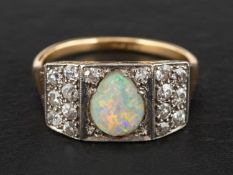 An oval, cabochon-cut opal and single-cut diamond cluster ring, estimated opal weight ca. 0.