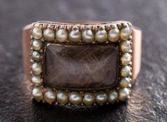 A Georgian mourning ring, the hairwork centrepiece with seed pearl surround,