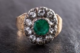 A 19th century foil backed, round, mixed-cut emerald and rose-cut diamond cluster ring,