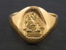 A signet ring, engraved with heraldic device, length of ring head ca. 1.