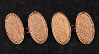 A pair of oval, cufflinks with engine-turned decoration, with hallmarks for Birmingham, 1927,