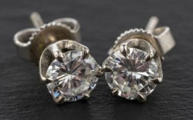 A pair of round, brilliant-cut diamond ear studs, total estimated diamond weight ca.