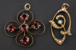 Two openwork pendants, including a seed pearl pendant of foliate design, stamped '9CT',
