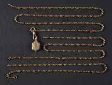 A belcher-link watch chain (a/f) with dog clip and locket pendant, with engraved foliate decoration,