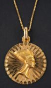 A medallion pendant, depicting Nefertiti's profile in relief, stamped '750',