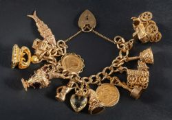 A 9ct gold, curb-link charm bracelet with heart-shaped clasp, including a sovereign gold coin,