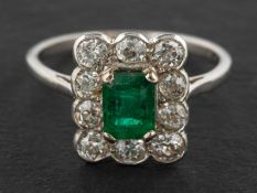 An emerald-cut emerald and old-cut diamond cluster ring, estimated emerald weight ca. 0.