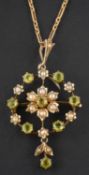 An openwork, green paste and seed pearl necklace, with central flowerhead design,