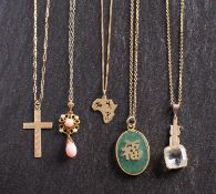 Five pendants, including a cruciform pendant, stamped '9CT'; a pendant in the shape of Africa,