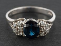 An 18ct gold, oval, mixed-cut sapphire and single-cut diamond ring, estimated sapphire weight ca.