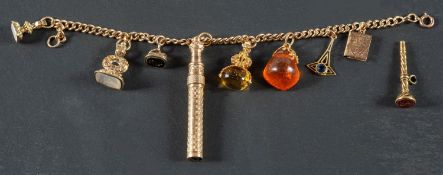 A curb-link charm bracelet, stamped '9CT', including a citrine swivel fob, two agate fobs,