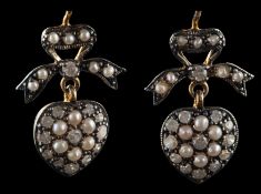 A pair of seed pearl and single-cut diamond, heart-shaped drop earrings, with bow surmount,
