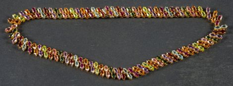 A vari-coloured gemset collar necklace,