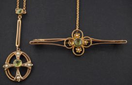 An openwork peridot and seed pearl brooch and pendant, the brooch stamped '15CT', the pendant '9CT',