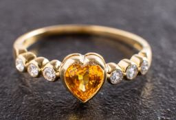 An 18ct gold, heart-shaped yellow sapphire and round, brilliant-cut diamond ring,