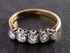 A round, brilliant-cut diamond, five-stone ring, total estimated diamond weight ca. 0.