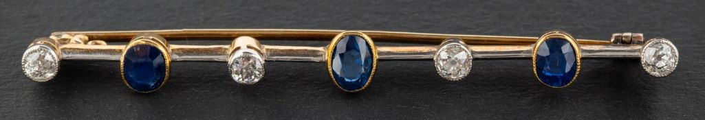 An old-cut diamond and oval, mixed-cut sapphire bar brooch, total estimated diamond weight ca. 0.