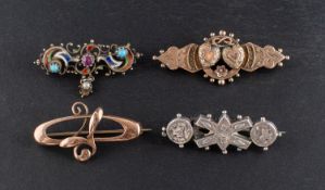 Four brooches, including an Art Nouveau style brooch, stamped '9CT',