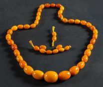 A graduated, amber bead necklace, diameter of beads ca. 8.9-22mms, length ca. 67cm, total weight ca.