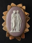 A 9ct gold Wedgwood, lilac, jasperware brooch, depicting two classical ladies in conversation,