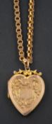 A heart shaped locket pendant, with engraved floral decoration, together with a fancy-link chain,