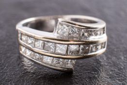 WITHDRAWN An 18ct gold and princess-cut diamond three-row, cross-over ring,
