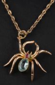 An aquamarine and ruby spider pendant, estimated aquamarine weight ca. 0.