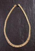 A 9ct gold, brick-link fringe necklace, with import marks for London 1975, total length ca.