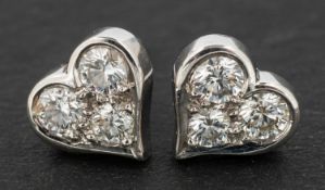 A pair of Tiffany, heart-shaped, round, brilliant-cut diamond ear studs, total diamond weight 0.