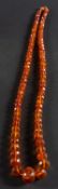 A graduated, faceted amber bead necklace, diameter of beads ca. 8-25mms, total length ca.