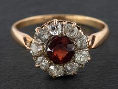 A garnet and old-cut diamond cluster ring, estimated garnet weight ca. 0.