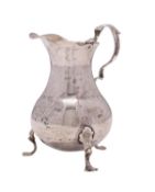 A George II silver cream jug, maker I.