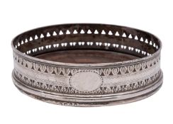 A George III silver bottle coaster, unknown maker, London, 1794, faded crest,
