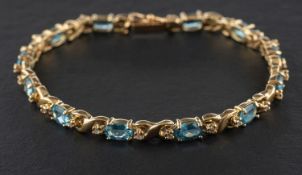 An oval, mixed-cut aquamarine and single-cut diamond 'X'-link bracelet,