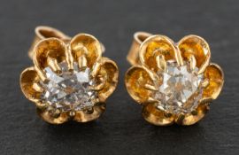 A pair of cushion-cut diamond ear studs, estimated total diamond weight ca. 1.