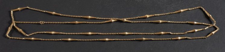 A fancy-link chain, with foliate engraved elongated hexagonal pyramid spacers, total length ca.