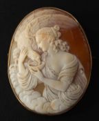 A carved shell cameo brooch depicting Hebe, the goddess of youth, the mount stamped '9CT', length 5.